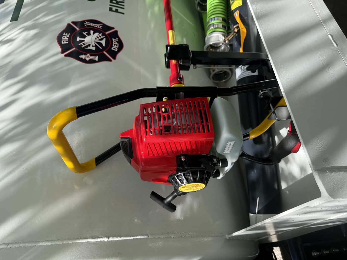Red pump equipment mounted on the Open Range septic truck.